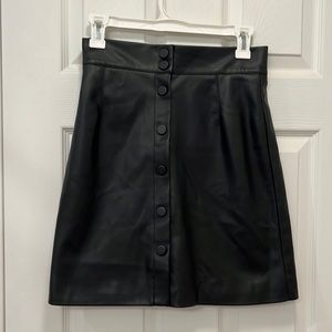 Faux black leather mini skirt